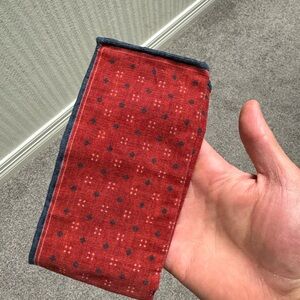 Brunello Cucinelli pocket square. Red/burnt orange type color, 100% cotton.